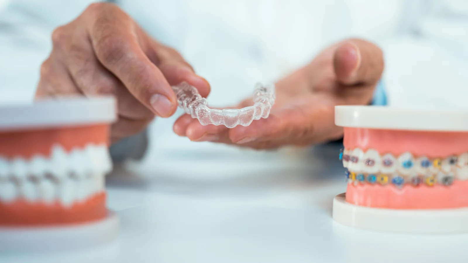 Invisalign® clear aligner alongside fixed braces