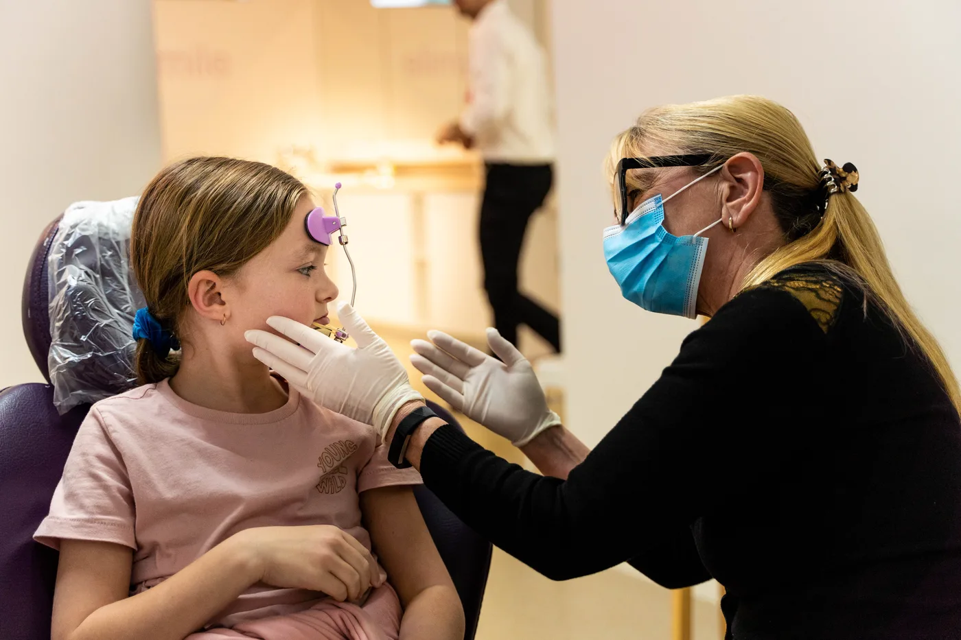 A specialist with a young orthodontic patient A specialist with a young orthodontic patient