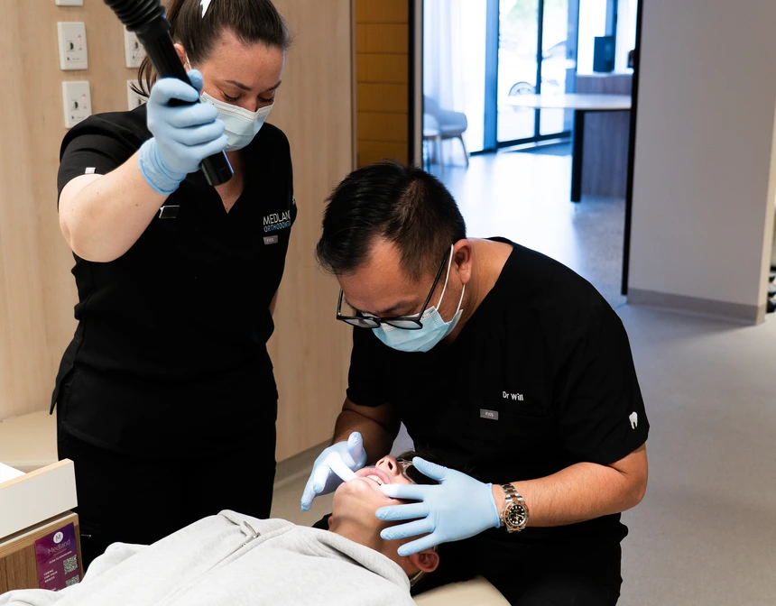 A Specialist Orthodontist with a patient A Specialist Orthodontist with a patient