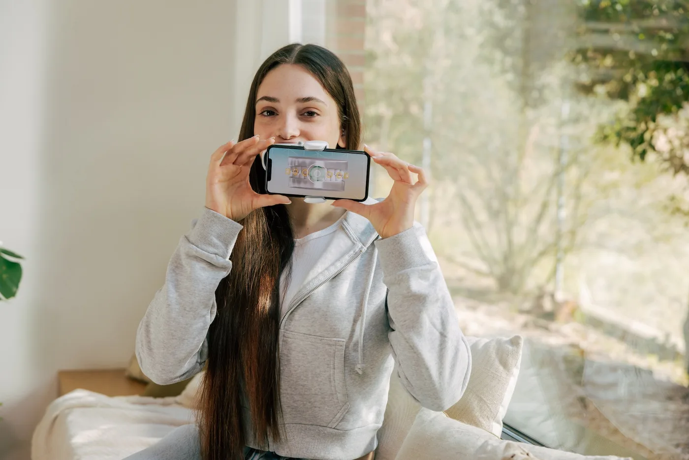 Specialist Orthodontist reviewing a teenager's Invisalign progress Specialist Orthodontist reviewing a teenager's Invisalign progress