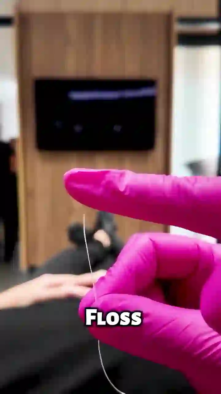 Demonstration of flossing around a bonded retainer